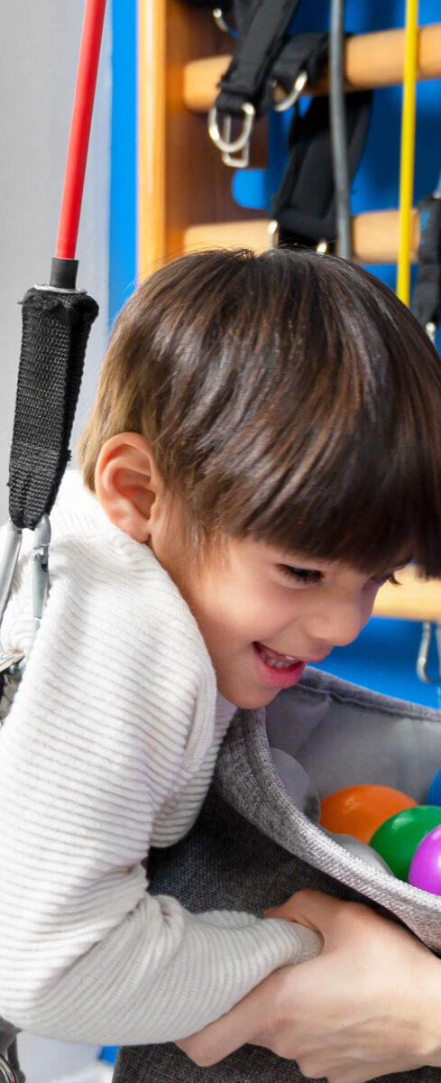 Boy with cerebral palsy doing physical therapy